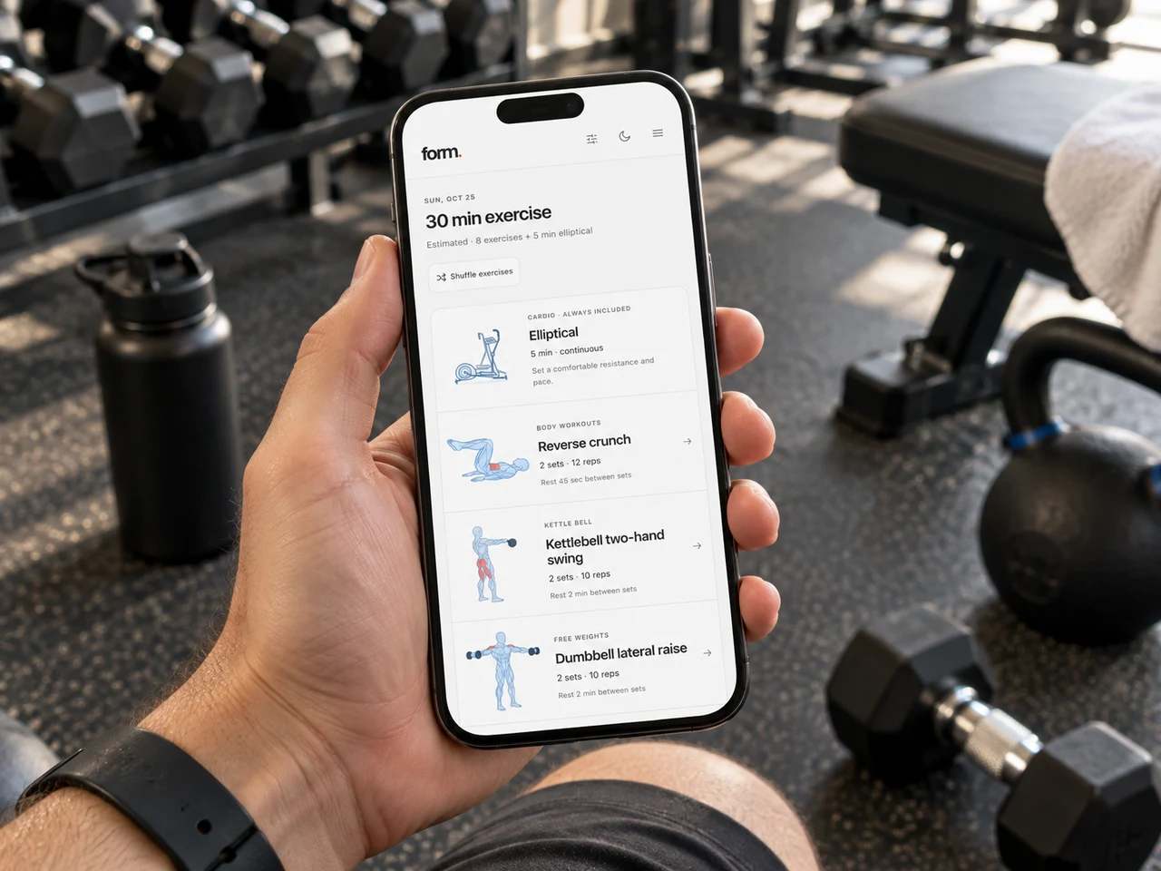 Form's daily workout displayed on a phone held in one hand at the gym, with illustrated exercises, sets, reps, and rest intervals.